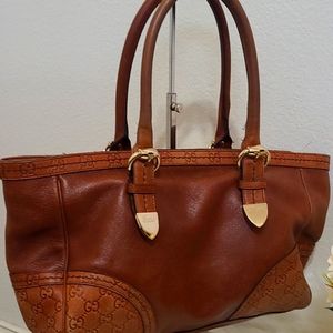 Gucci tote! Beautiful brown, leather. Lots of space inside. Clean inside & out